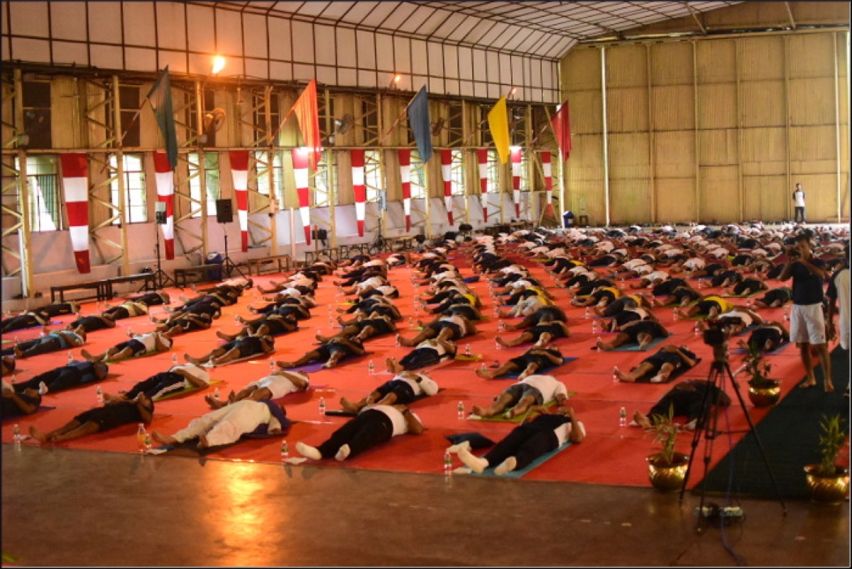 Group breathwork and movement practice — structured daily recovery resets the nervous system