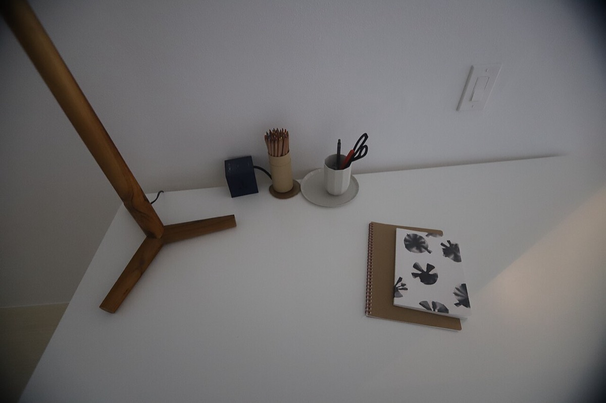 A clean minimalist office with bright light: mental clarity becomes default when the environment supports it