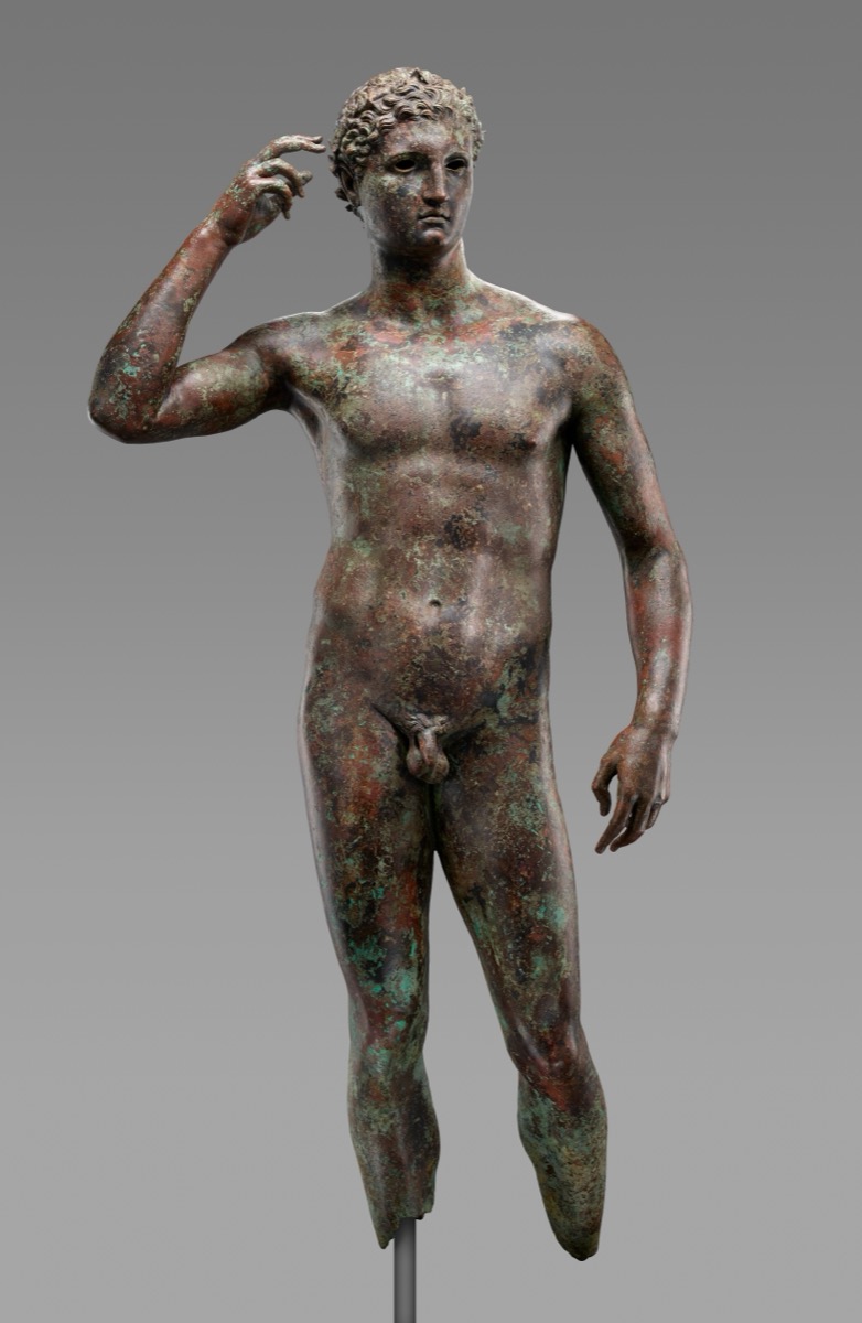 The Statue of a Victorious Youth — ancient Greek bronze, circa 300–100 BC, showing the physical ideal of a trained and disciplined athlete