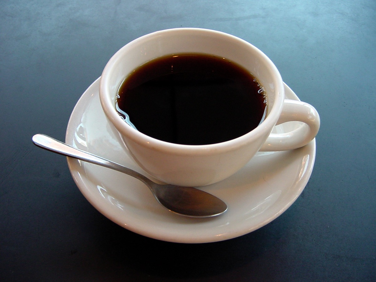 A simple cup of coffee on a calm morning table: intentional morning starts with what you chose, not what notified you