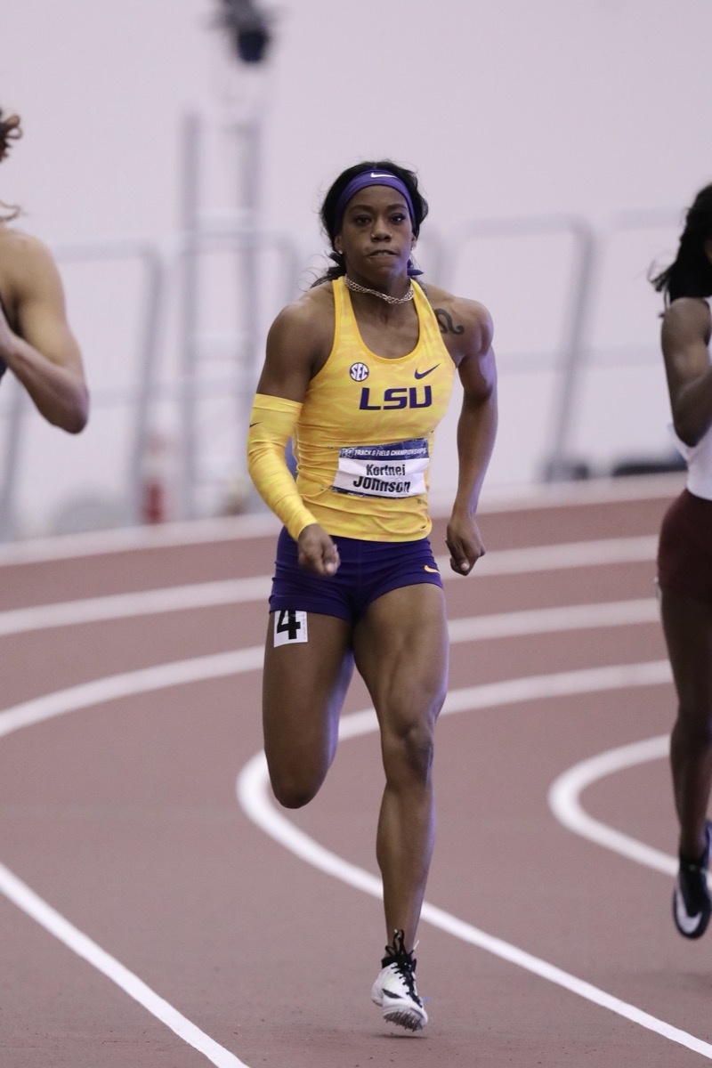 A sprinter driving forward on the track, the bias toward action that outpaces the perfectionist.