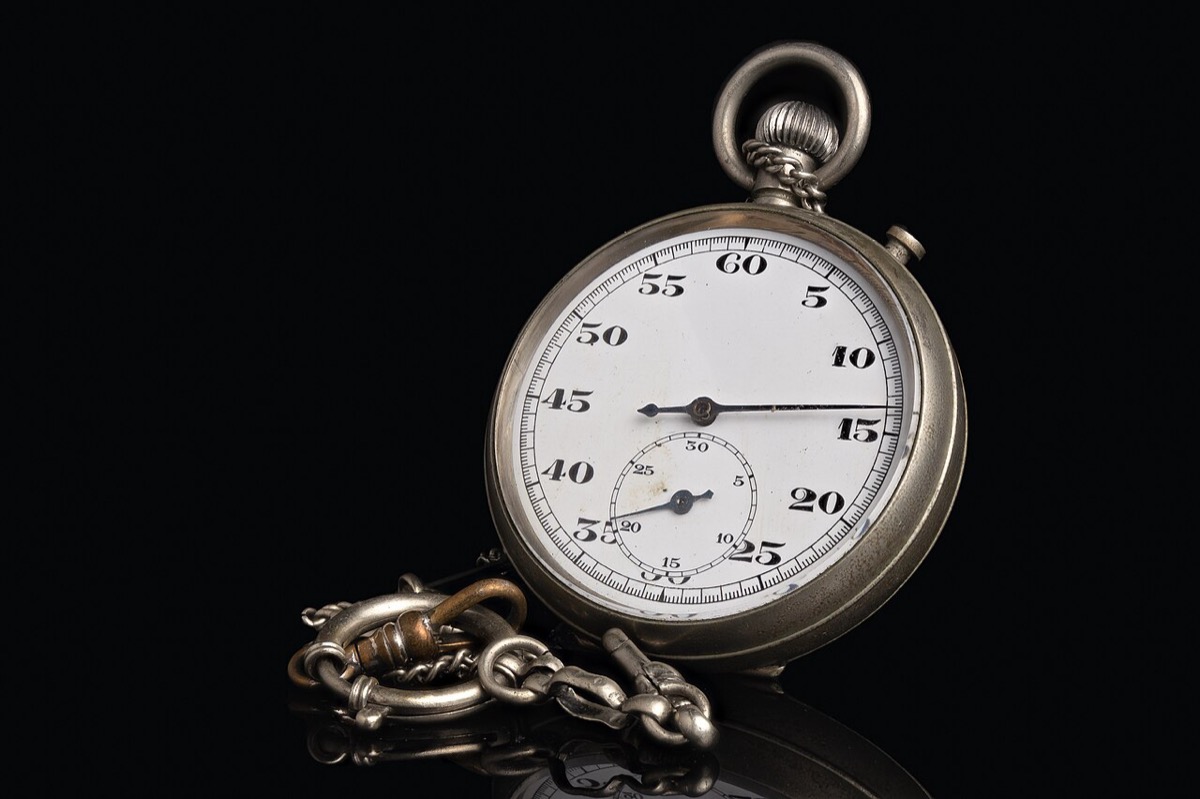 Analog stopwatch marking a narrow margin of time: the one percent is the difference between the best and the rest, and it is crossable