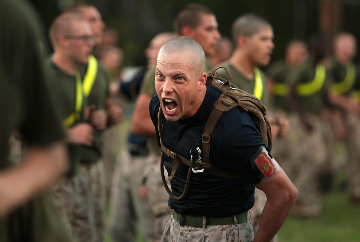 A Marine Corps sergeant encouraging recruits during physical training at Parris Island