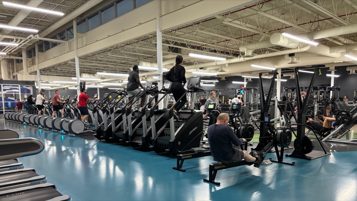 People exercising at a community centre — the kind of repeated, unglamorous action that builds real identity change